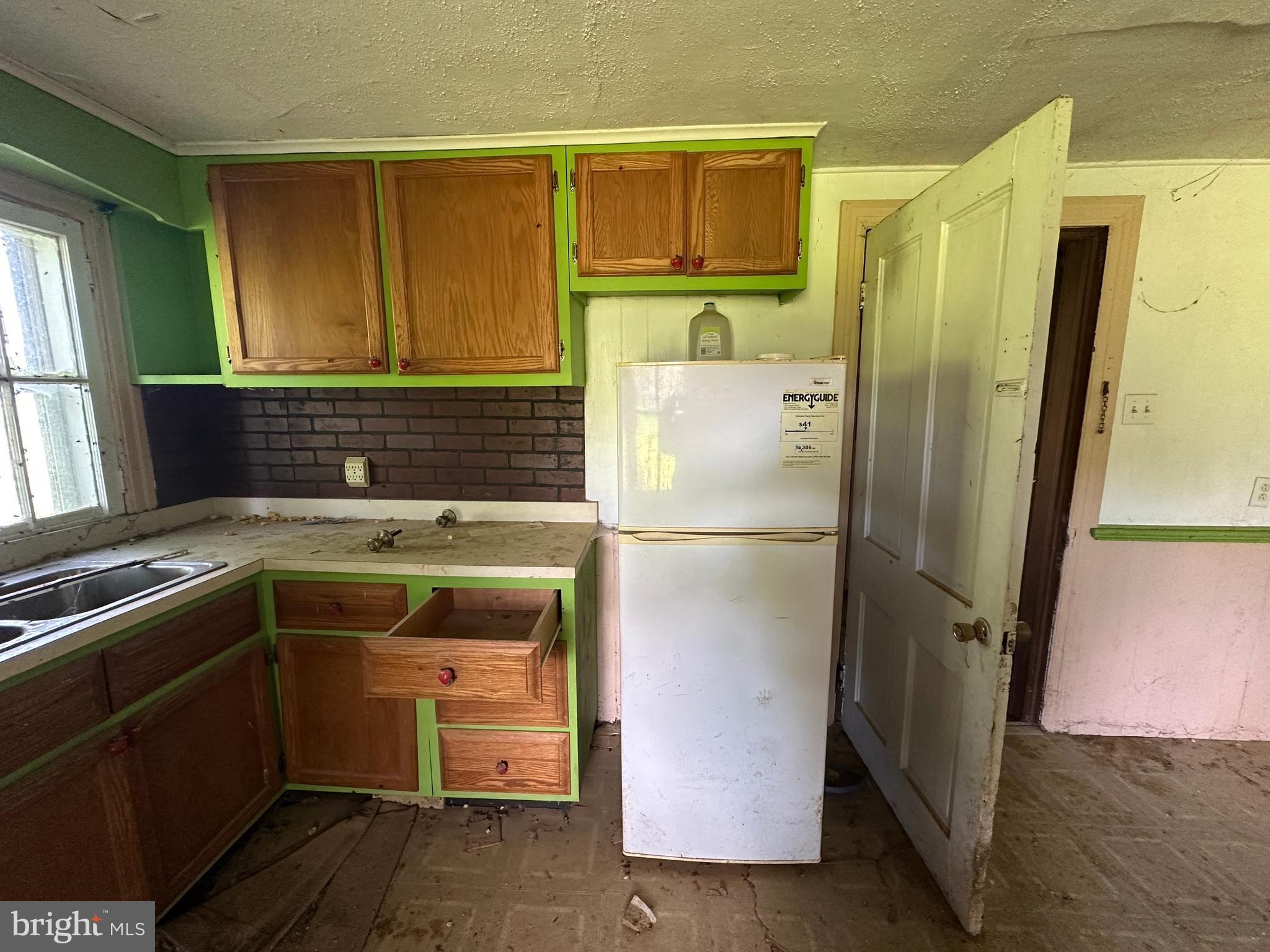 12007 White Hall Road Chewsville, MD 21783 - Photo 26 of 42 a room with a refrigerator and a sink