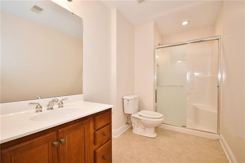 115 Haverford Circle Pittsburgh, PA 15228 - Photo 23 of 25 This full bath is in the lower level finished basement. There is also a large storage room, storage closet, and a utility room.