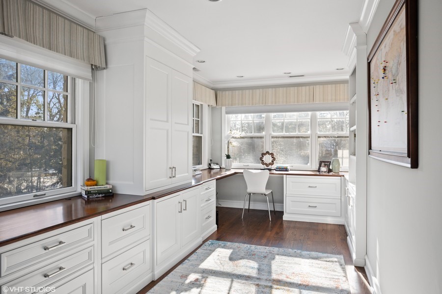 106 Woodley Road Winnetka, IL 60093 - Photo 28 of 44 a large white kitchen with granite countertop a large window sink and cabinets