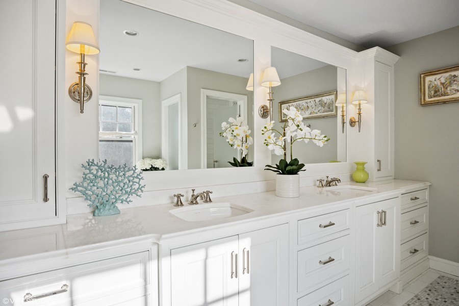 106 Woodley Road Winnetka, IL 60093 - Photo 29 of 44 a bathroom with a sink and a mirror