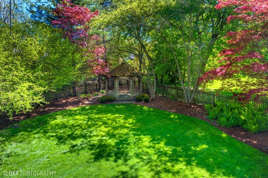 106 Woodley Road Winnetka, IL 60093 - Photo 38 of 44 a view of a backyard with a garden