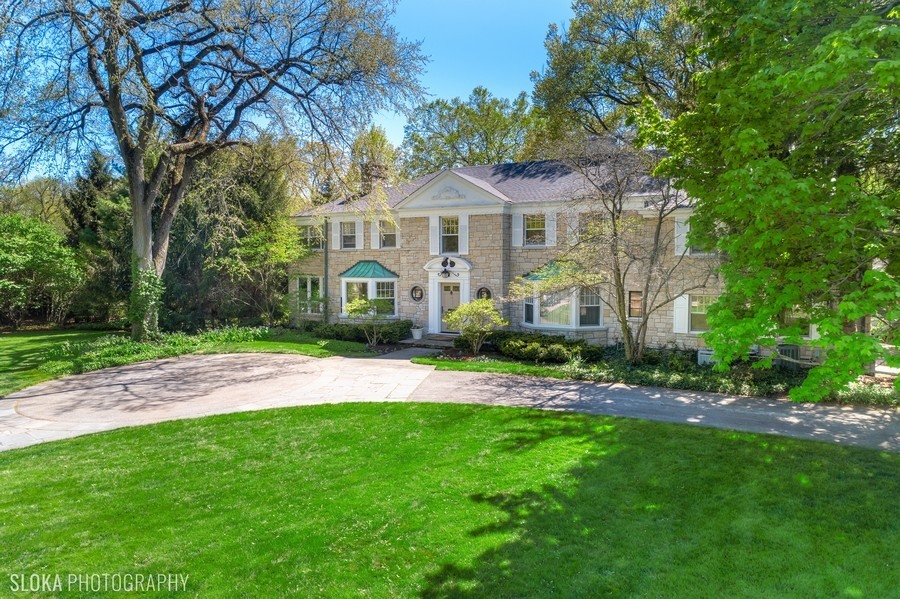 106 Woodley Road Winnetka, IL 60093 - Photo 39 of 44 a front view of a house with a garden