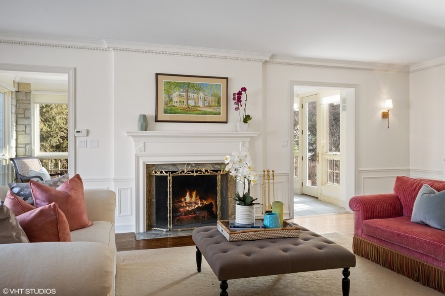 106 Woodley Road Winnetka, IL 60093 - Photo 4 of 44 a living room with furniture and a fireplace