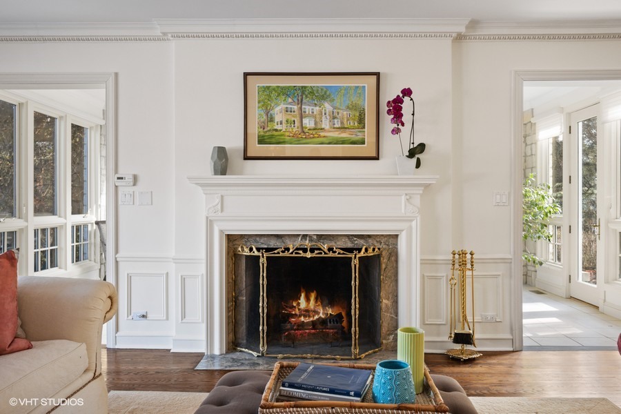 106 Woodley Road Winnetka, IL 60093 - Photo 5 of 44 a living room with furniture and a fireplace