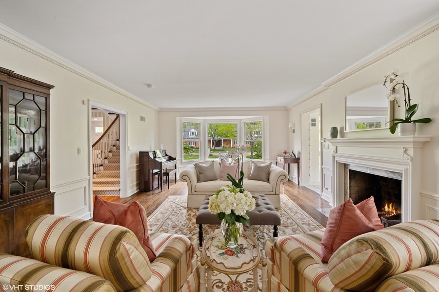 106 Woodley Road Winnetka, IL 60093 - Photo 6 of 44 a living room with furniture and a fireplace