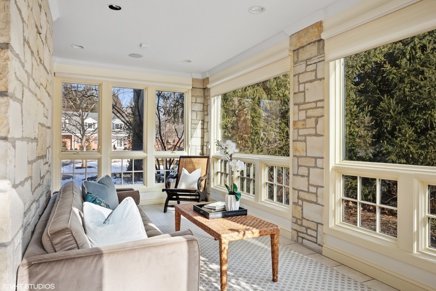 106 Woodley Road Winnetka, IL 60093 - Photo 7 of 44 a living room with furniture and large windows