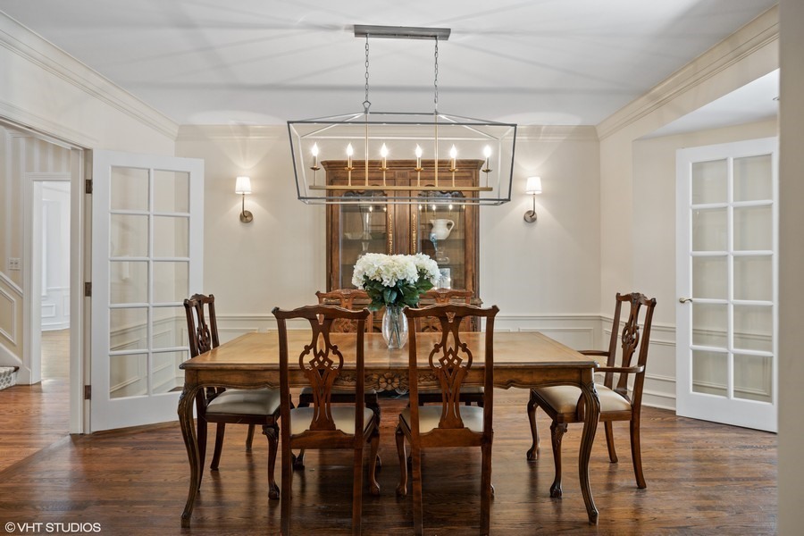 106 Woodley Road Winnetka, IL 60093 - Photo 10 of 44 a view of a dining room with furniture window and wooden floor
