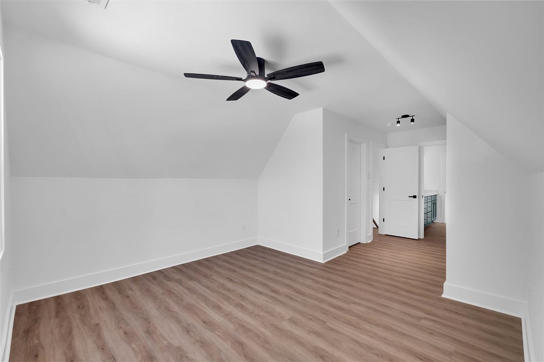 407 Blue Ridge Court Westminster, SC 29693 - Photo 34 of 48 This bright space features sloped ceilings and durable flooring, perfect for a versatile living area.