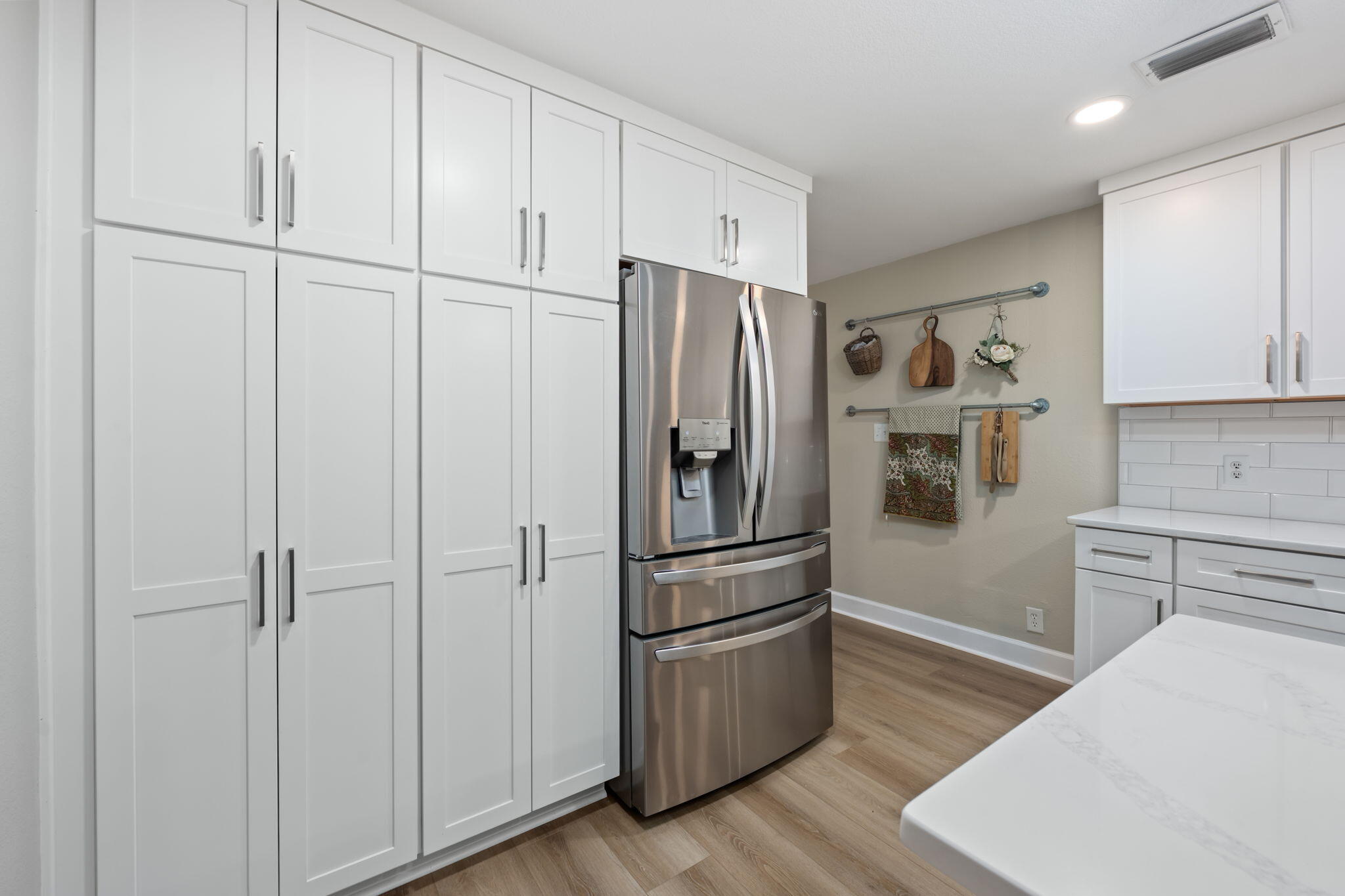 255 Edge Avenue Valparaiso, FL 32580 - Photo 17 of 73 a kitchen with stainless steel appliances a refrigerator and cabinets