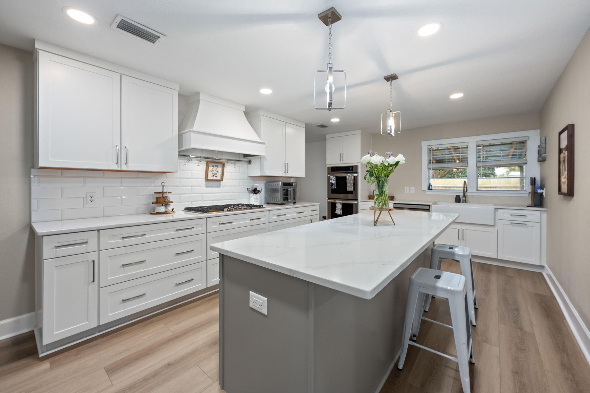 255 Edge Avenue Valparaiso, FL 32580 - Photo 18 of 73 a large kitchen with kitchen island a stove a sink a refrigerator and a living room view