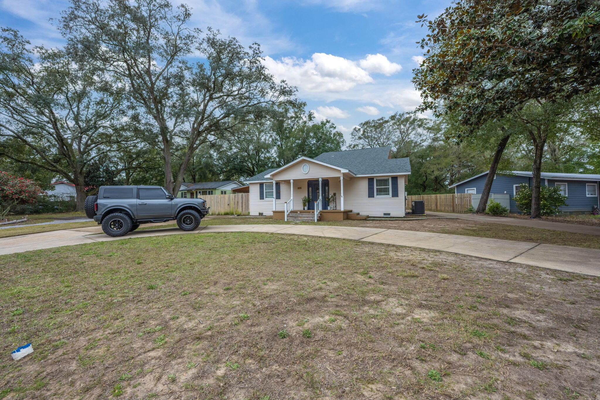 255 Edge Avenue Valparaiso, FL 32580 - Photo 2 of 73 a front view of a house with a garden