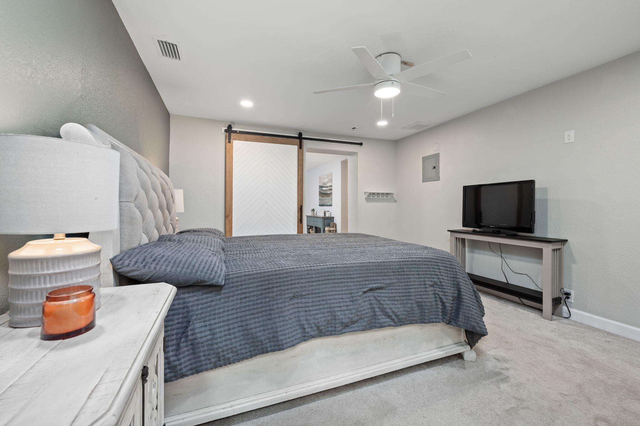 255 Edge Avenue Valparaiso, FL 32580 - Photo 26 of 73 a bedroom with a bed and tv