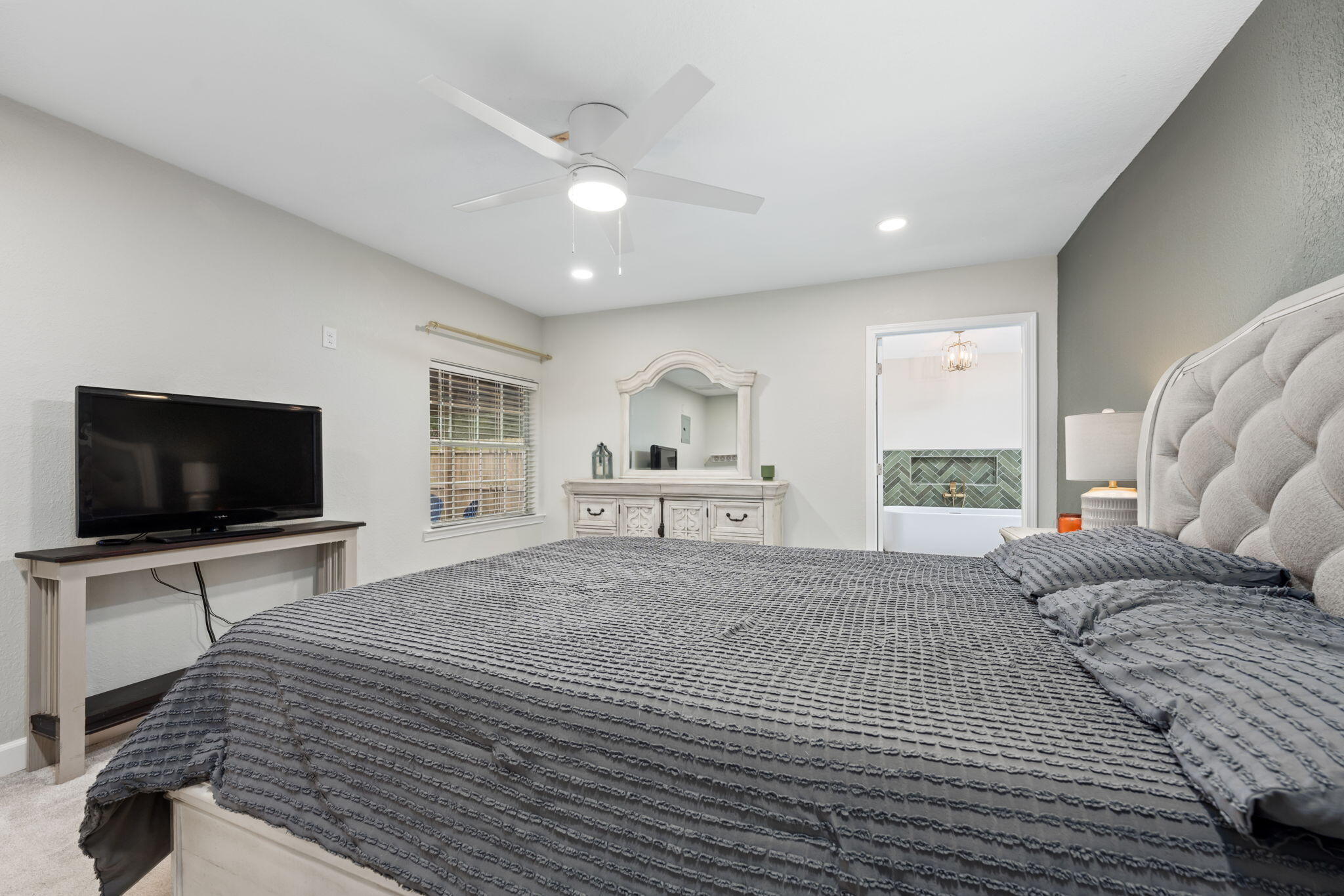 255 Edge Avenue Valparaiso, FL 32580 - Photo 27 of 73 a bedroom with a bed and a flat screen tv