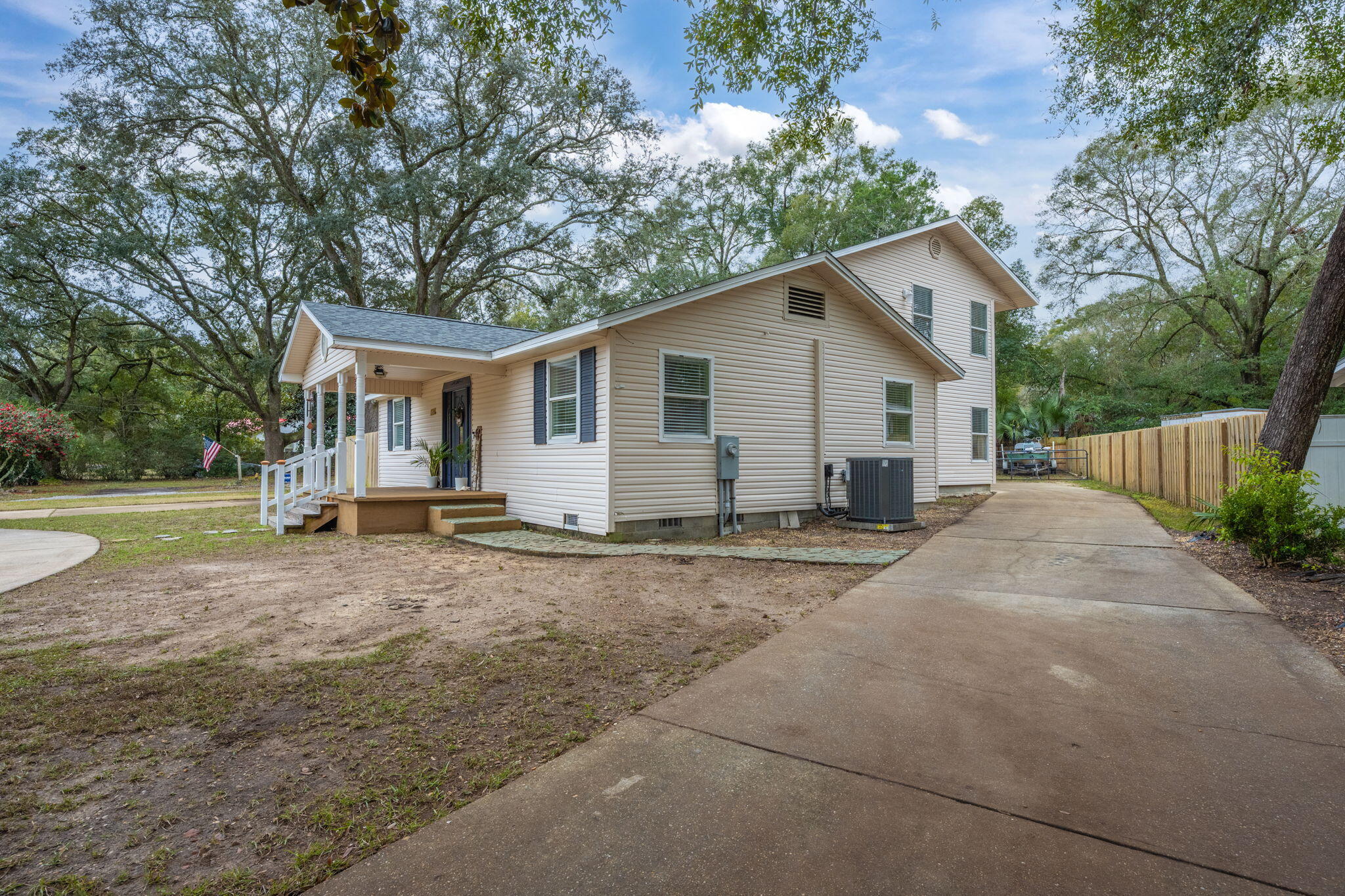 255 Edge Avenue Valparaiso, FL 32580 - Photo 4 of 73 a view of a house with backyard and a tree