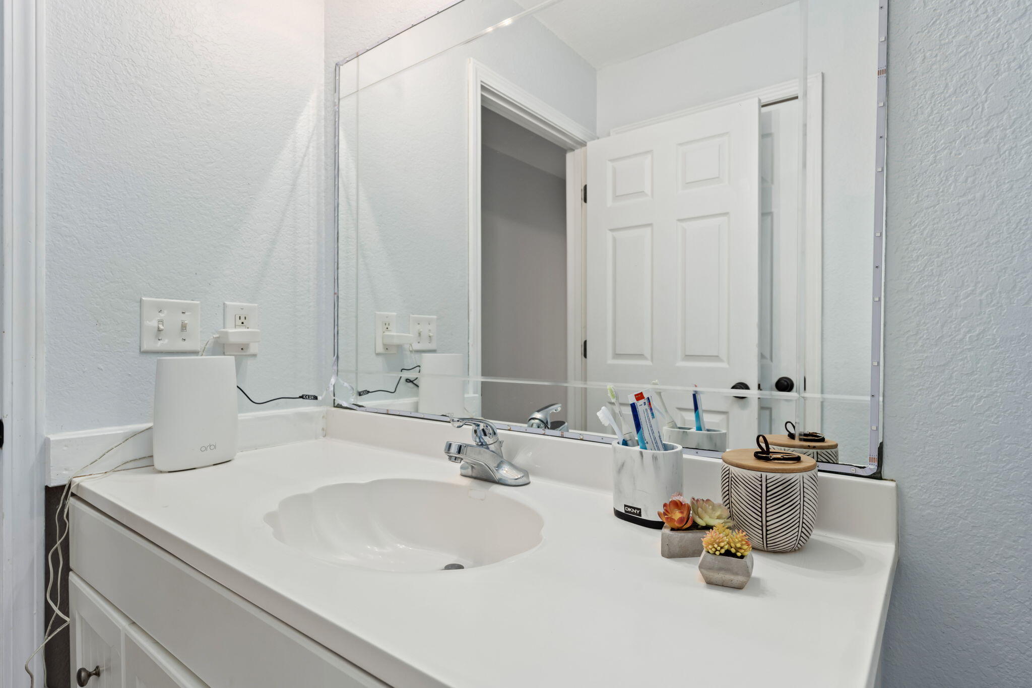 255 Edge Avenue Valparaiso, FL 32580 - Photo 53 of 73 a bathroom with a sink and a mirror