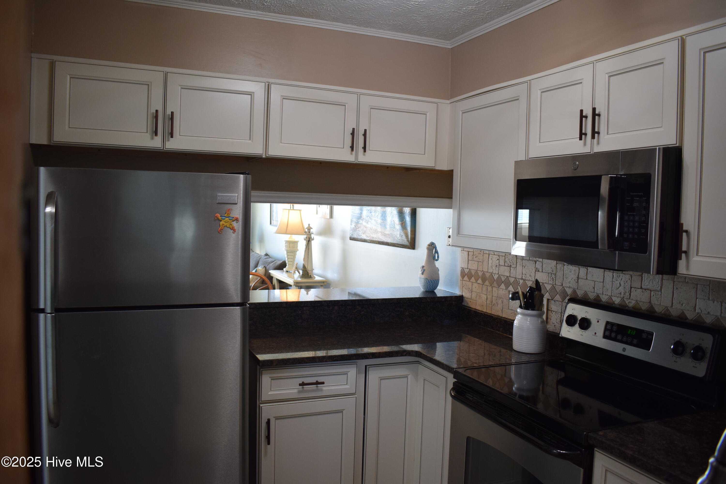 1000 Caswell Beach Road, Unit 405 Oak Island, NC 28465 - Photo 8 of 38 DSC_0673