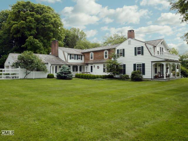 840 Verna Hill Road Fairfield, CT 06824 - Photo 1 of 1 a front view of a house with a garden and trees