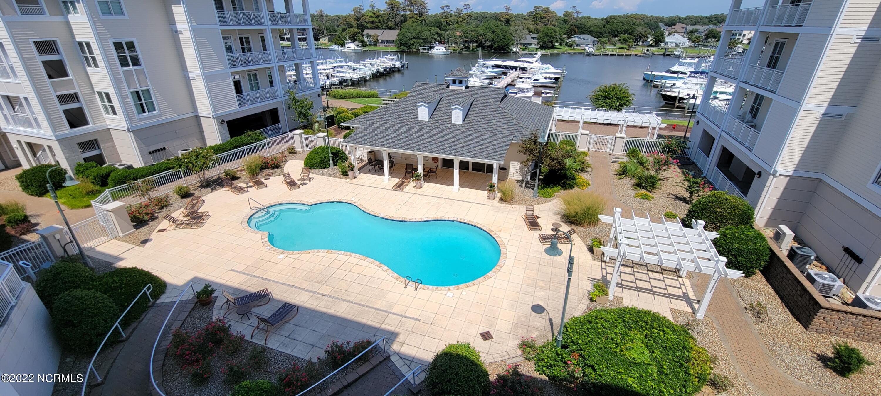 150 Lands End Road, Unit A33 Morehead City, NC 28557 - Photo 55 of 59 View of pool and clubhouse