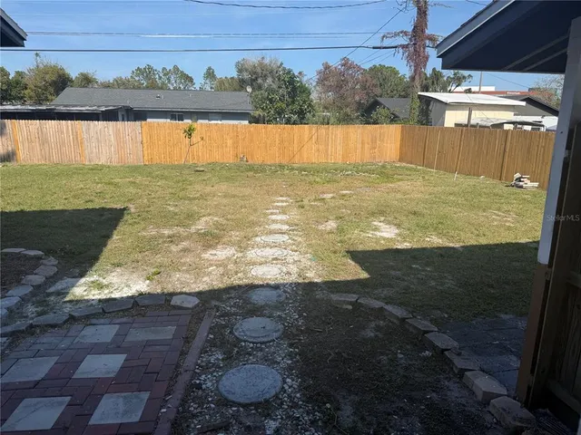 a view of a backyard of a house