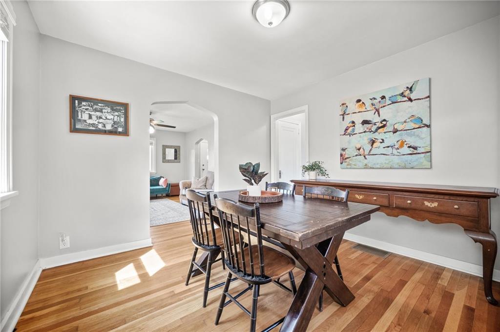 416 Phillips Avenue McKees Rocks, PA 15136 - Photo 12 of 46 a view of a dining room with furniture and wooden floor
