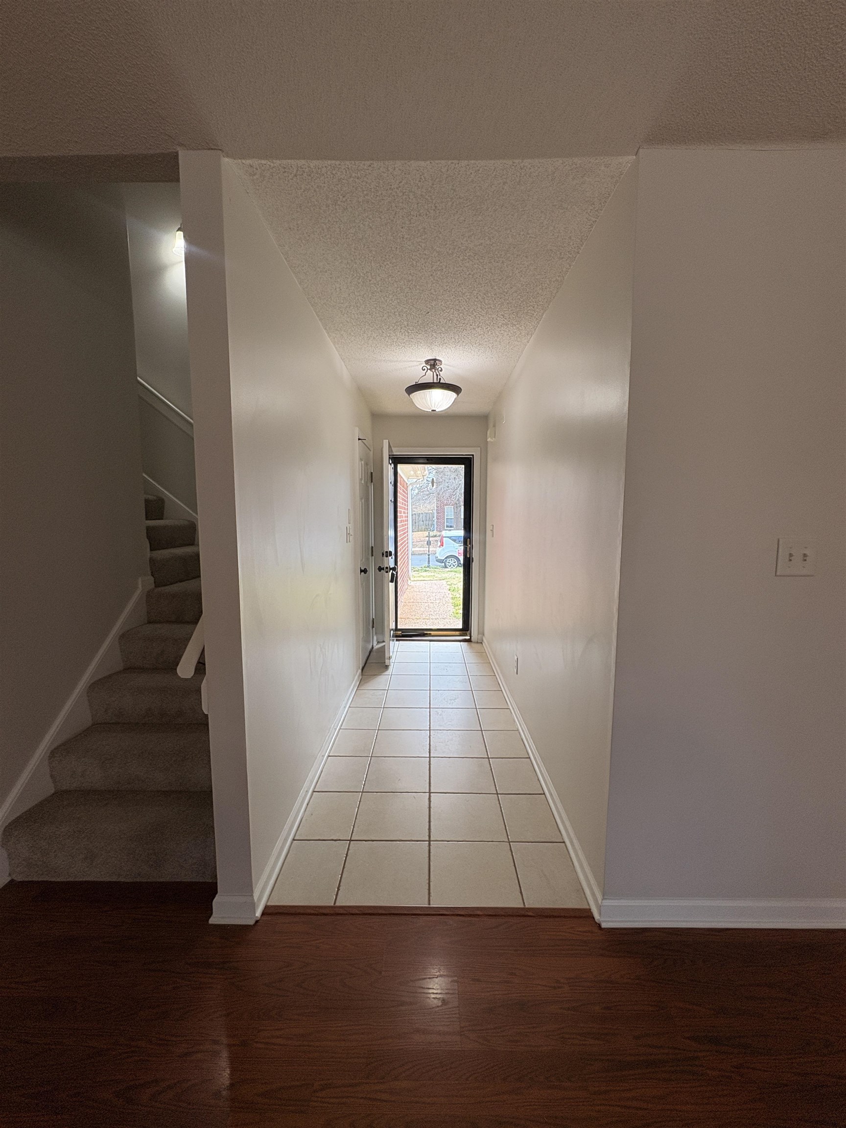 11590 Milton Ridge Cove Arlington, TN 38002 - Photo 16 of 24 Corridor with a textured ceiling and light wood finished floors