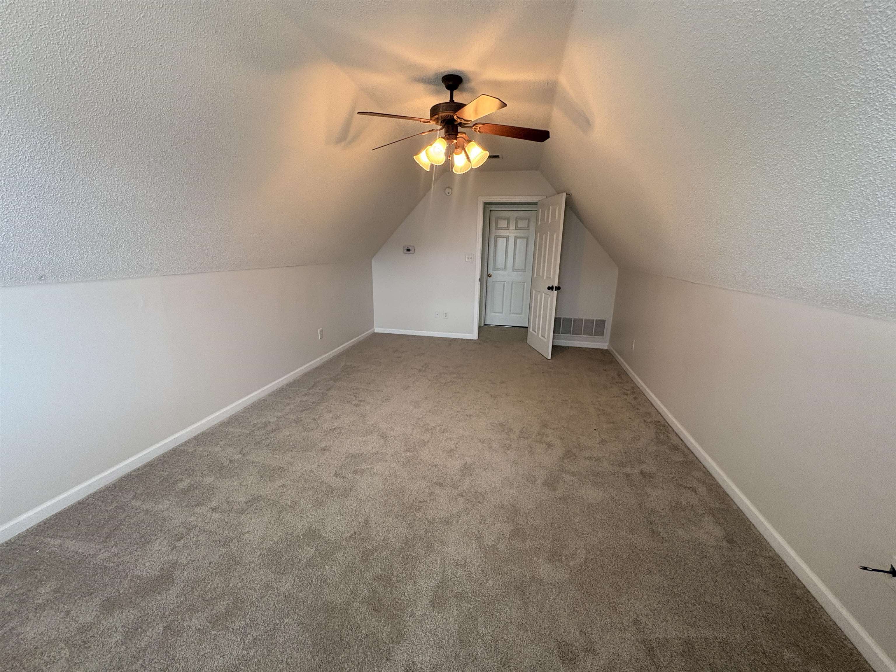 11590 Milton Ridge Cove Arlington, TN 38002 - Photo 23 of 24 Bonus room featuring a ceiling fan, a textured ceiling, and carpet