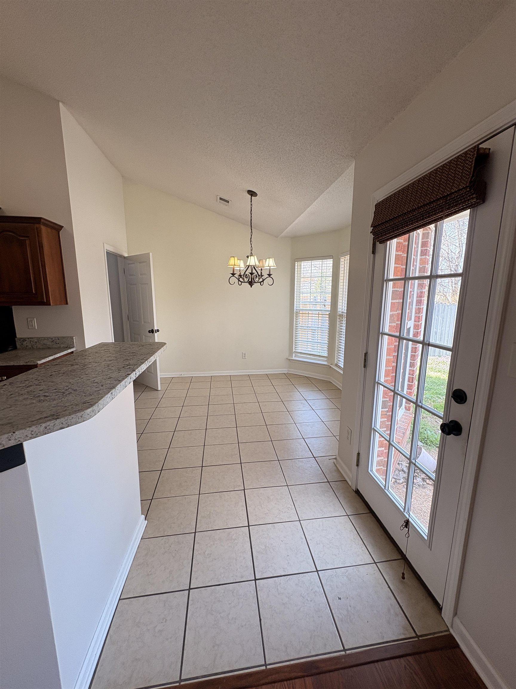 11590 Milton Ridge Cove Arlington, TN 38002 - Photo 7 of 24 Unfurnished dining area with suspended lighting and light tile patterned floors