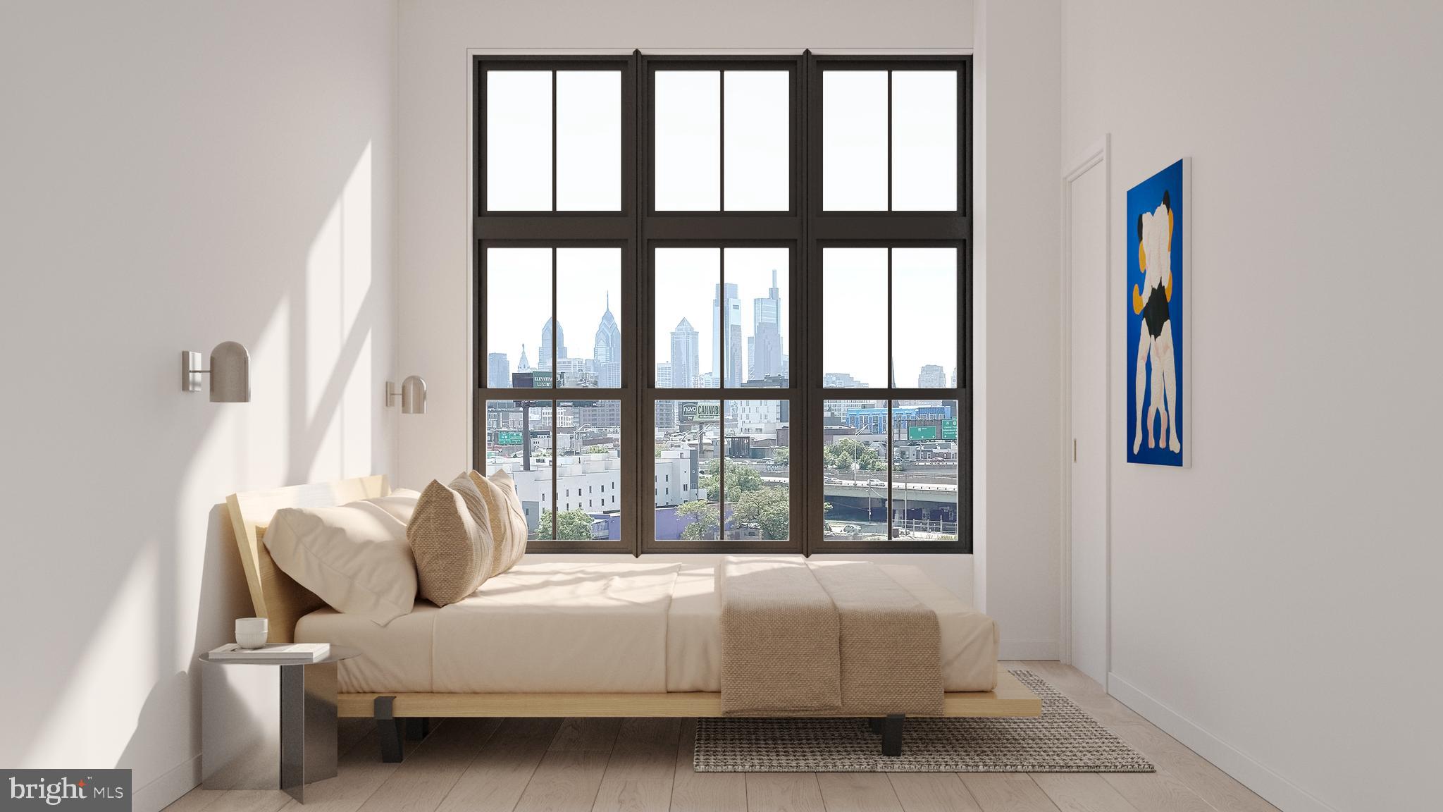 947-949 Frankford Avenue, Unit 208 Philadelphia, PA 19125 - Photo 11 of 20 a bedroom with a bed and a large window