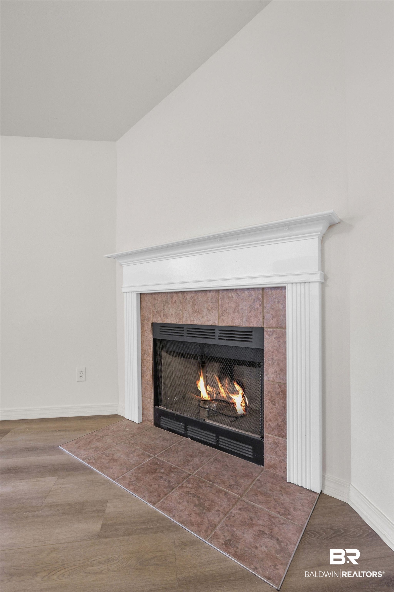 18620 Hammond Street Robertsdale, AL 36567 - Photo 16 of 23 Room details with wood-type flooring and a tile fireplace
