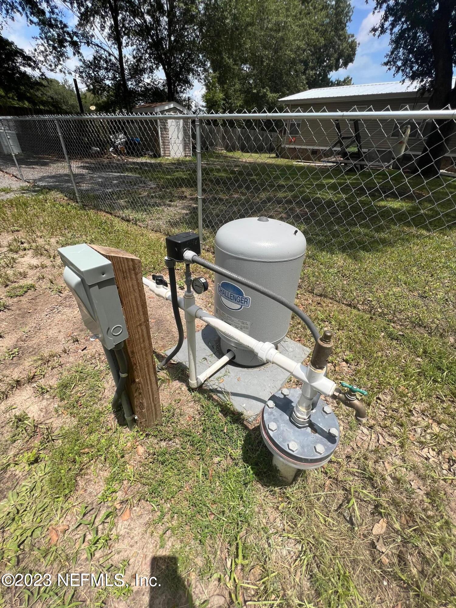 4097 South Wood Road Jacksonville, FL 32234 - Photo 7 of 7 a view of a swimming pool with a yard