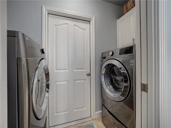 a view of a hallway with closet and workspace