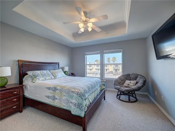 a view of a balcony with two chairs and wooden floor
