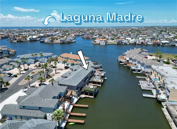 an aerial view of a house with a ocean view