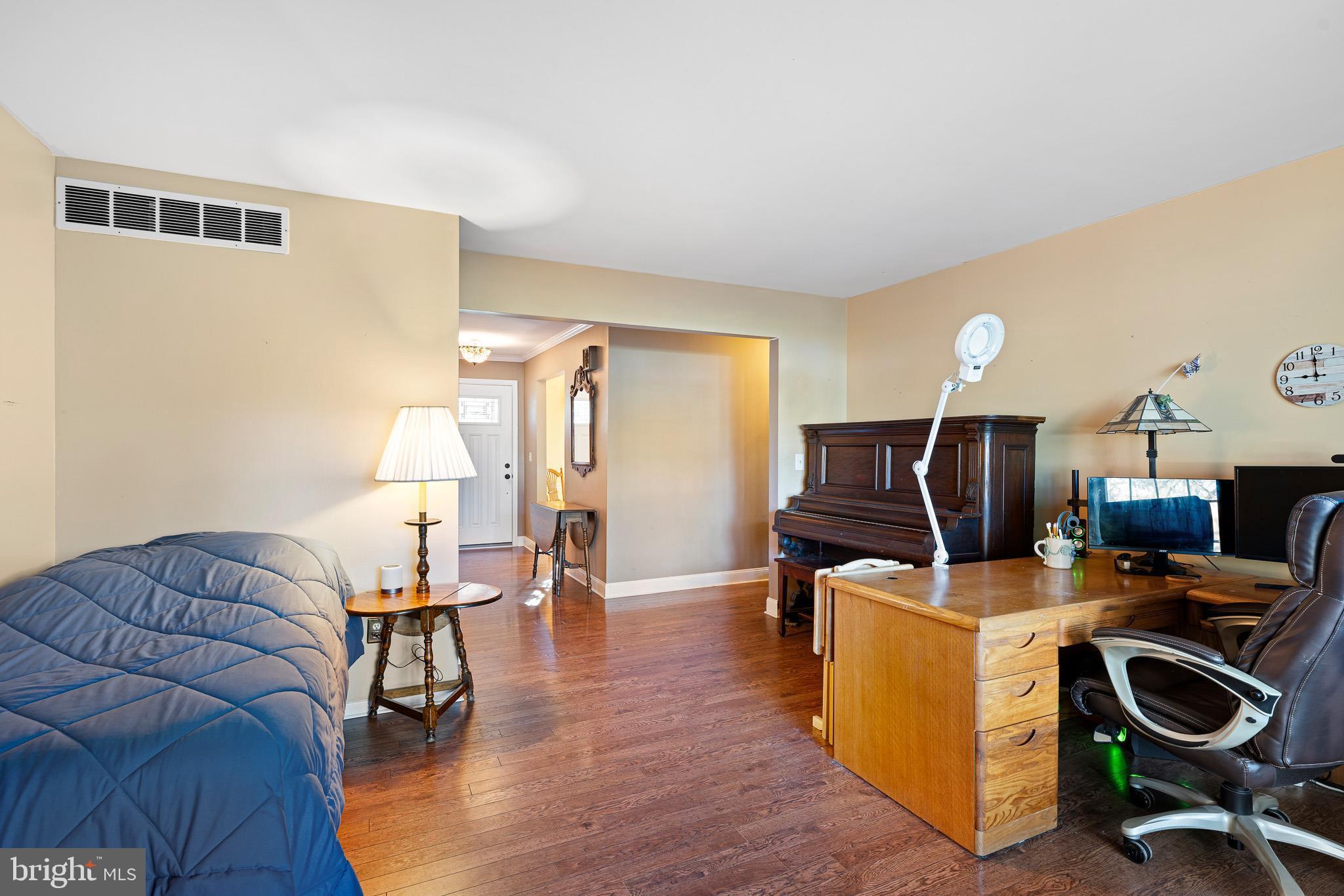 2209 Wheatleys Pond Road Smyrna, DE 19977 - Photo 11 of 39 a view of a livingroom with workspace and a couch