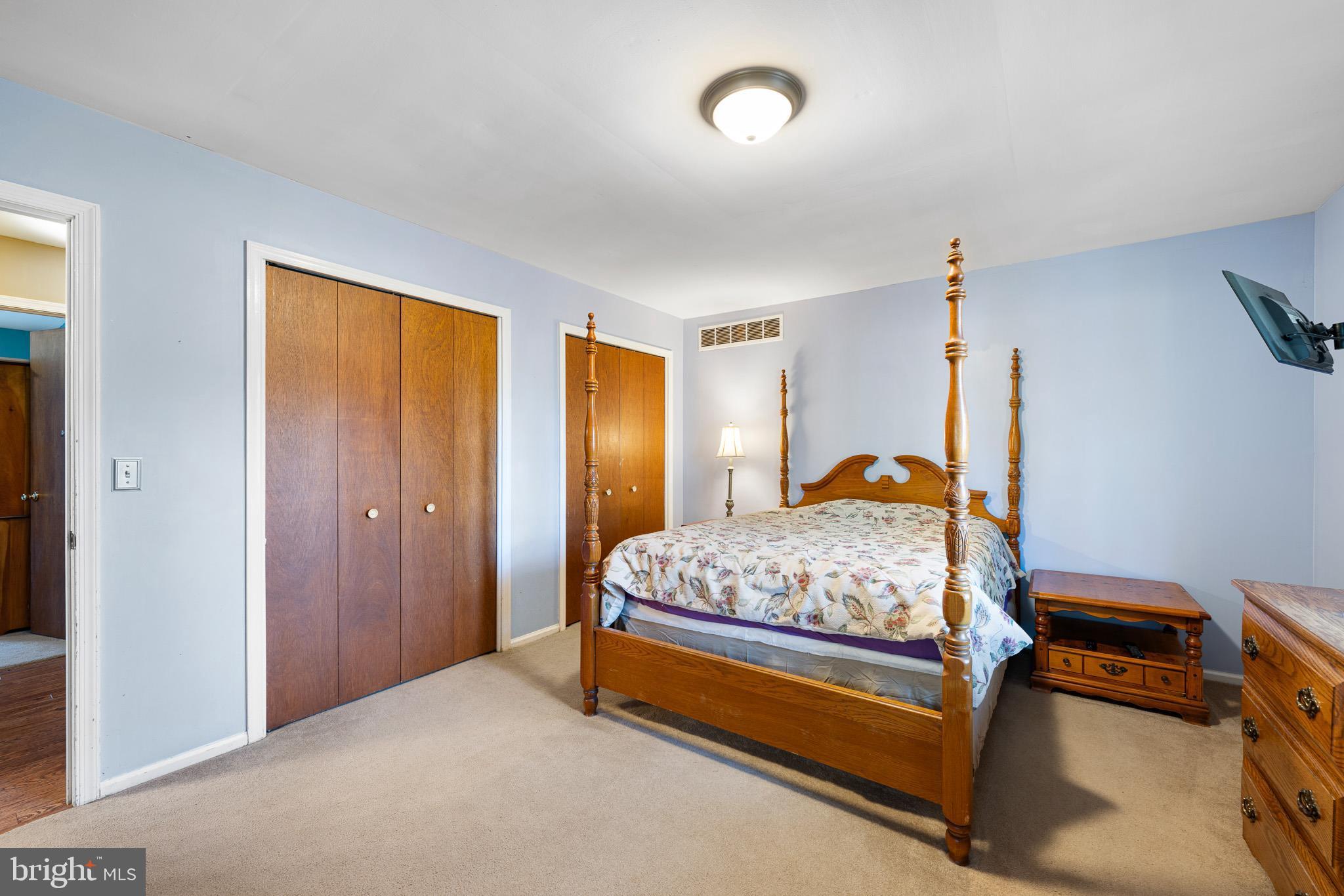 2209 Wheatleys Pond Road Smyrna, DE 19977 - Photo 17 of 39 a bedroom with a bed and a dresser