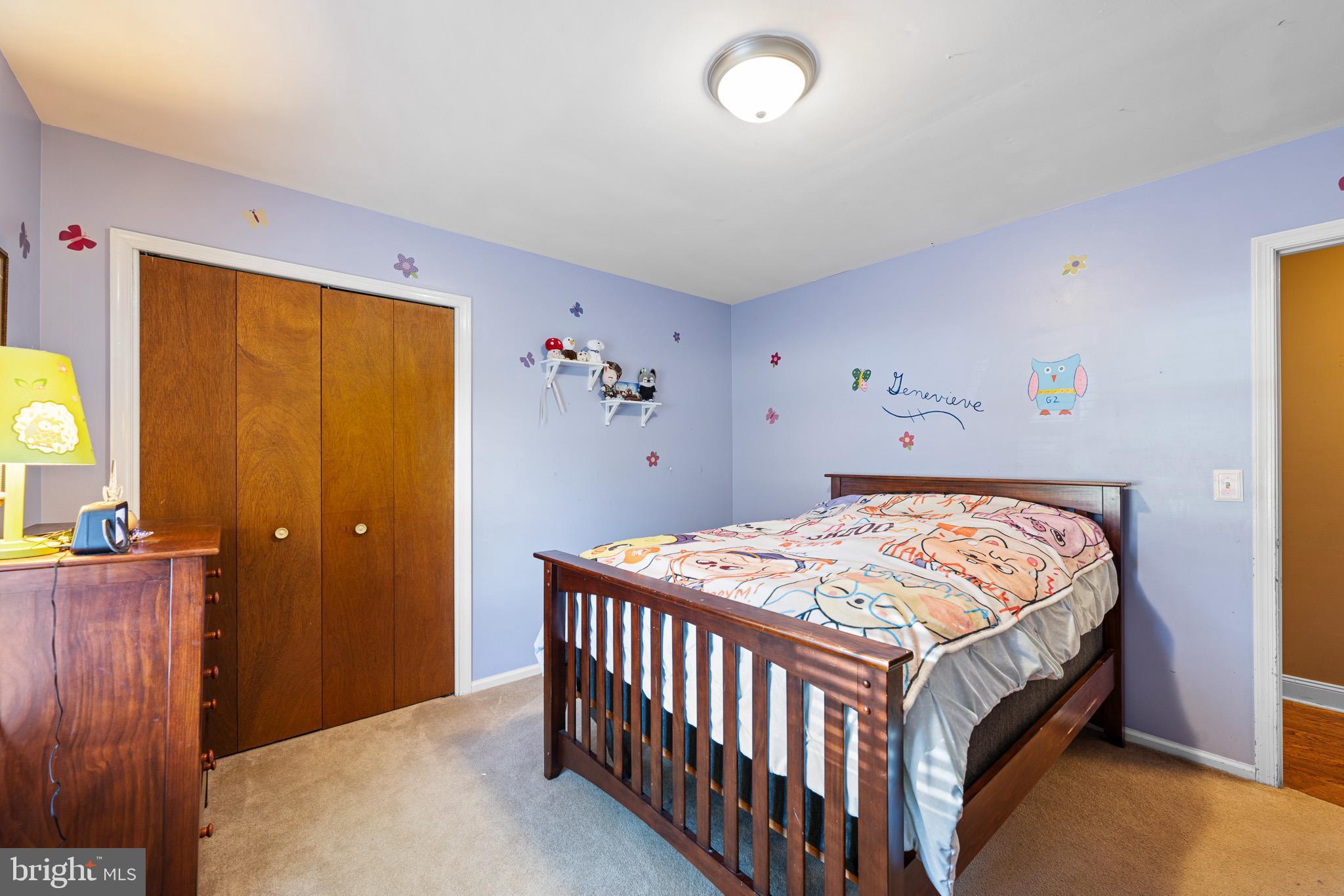 2209 Wheatleys Pond Road Smyrna, DE 19977 - Photo 21 of 39 a bedroom with a bed and a table