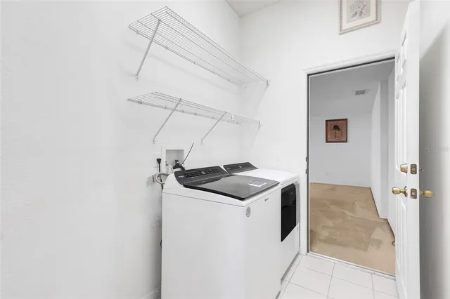 a utility room with washer and dryer