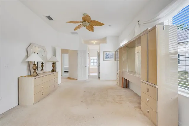 a large white kitchen with white cabinets