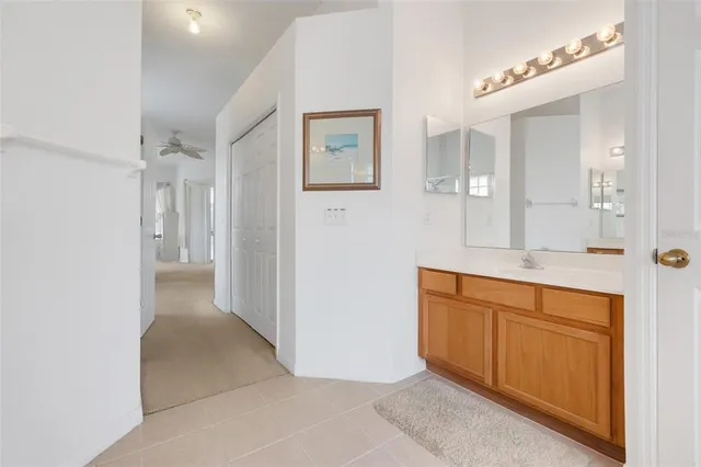 a spacious bathroom with a shower and a sink