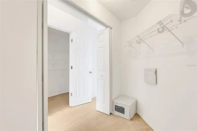 a view of a room with white walls