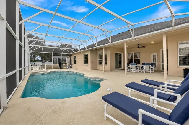 a view of kitchen with table and chairs