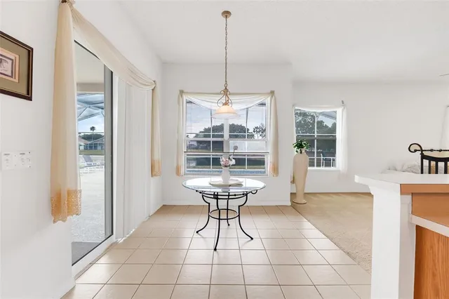a view of a room with windows and chandelier