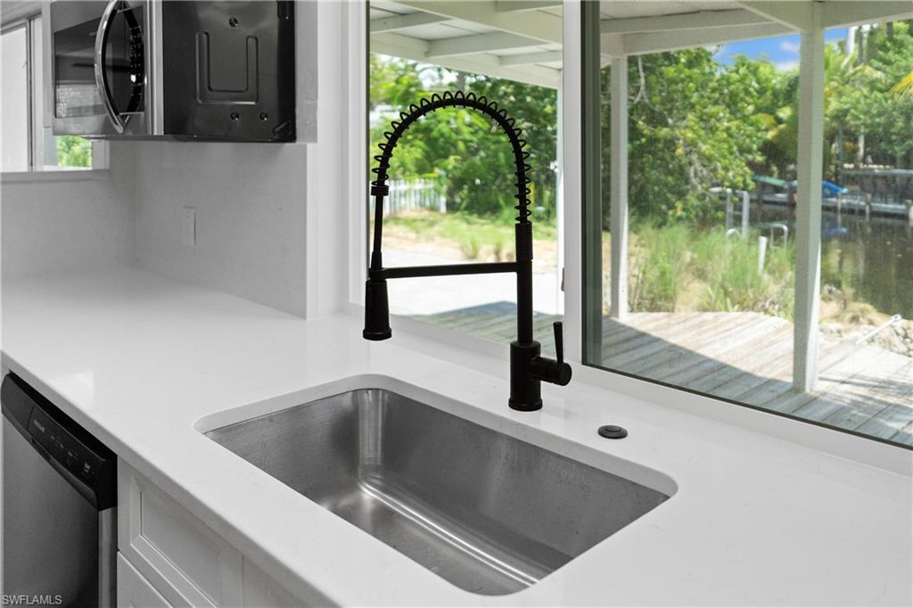 66 River Court Naples, FL 34110 - Photo 16 of 29 a view closeup a window