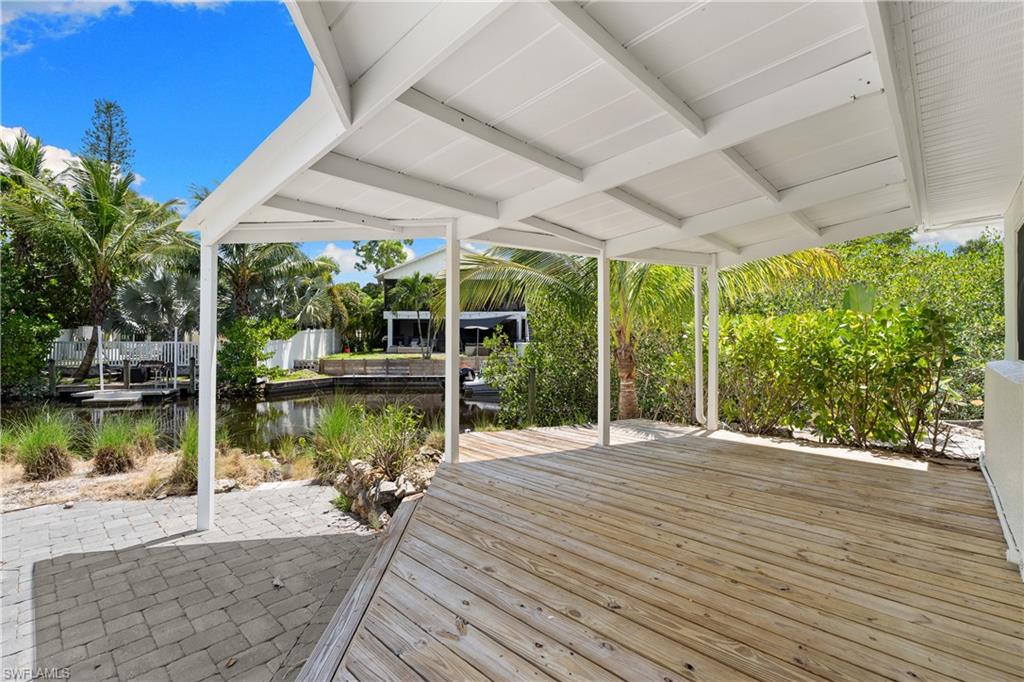 66 River Court Naples, FL 34110 - Photo 4 of 29 a house with yard