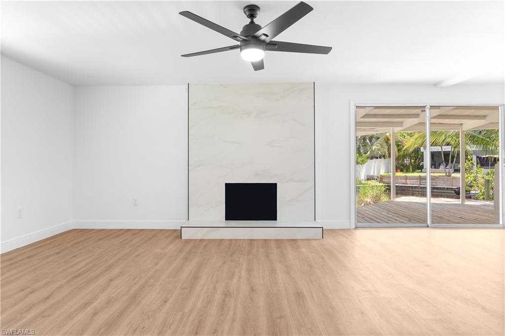 66 River Court Naples, FL 34110 - Photo 10 of 29 a view of an empty room with a window