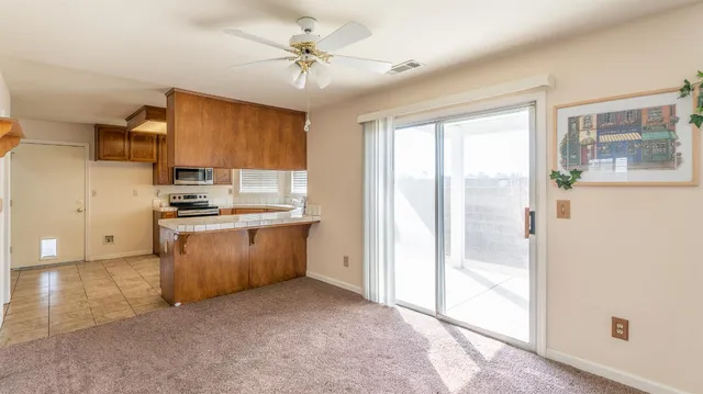 a kitchen with refrigerator cabinets and a sink