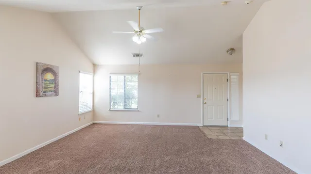 a view of an empty room with a window