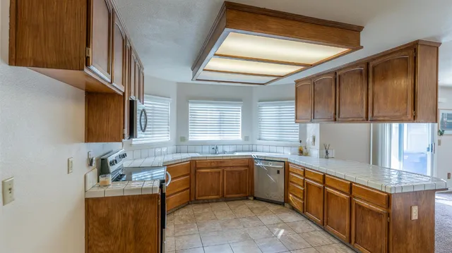 a kitchen with a sink and cabinets