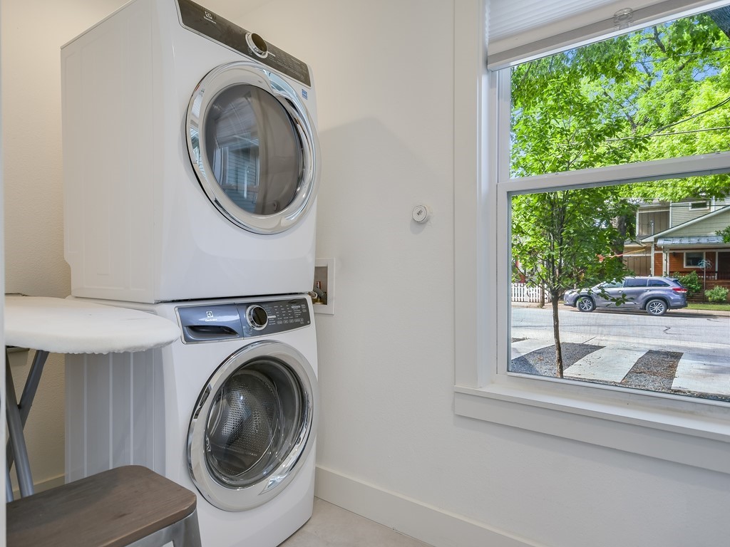 1313 Garden Street Austin, TX 78702 - Photo 11 of 23 a view of a storage and utility room with washer and dryer