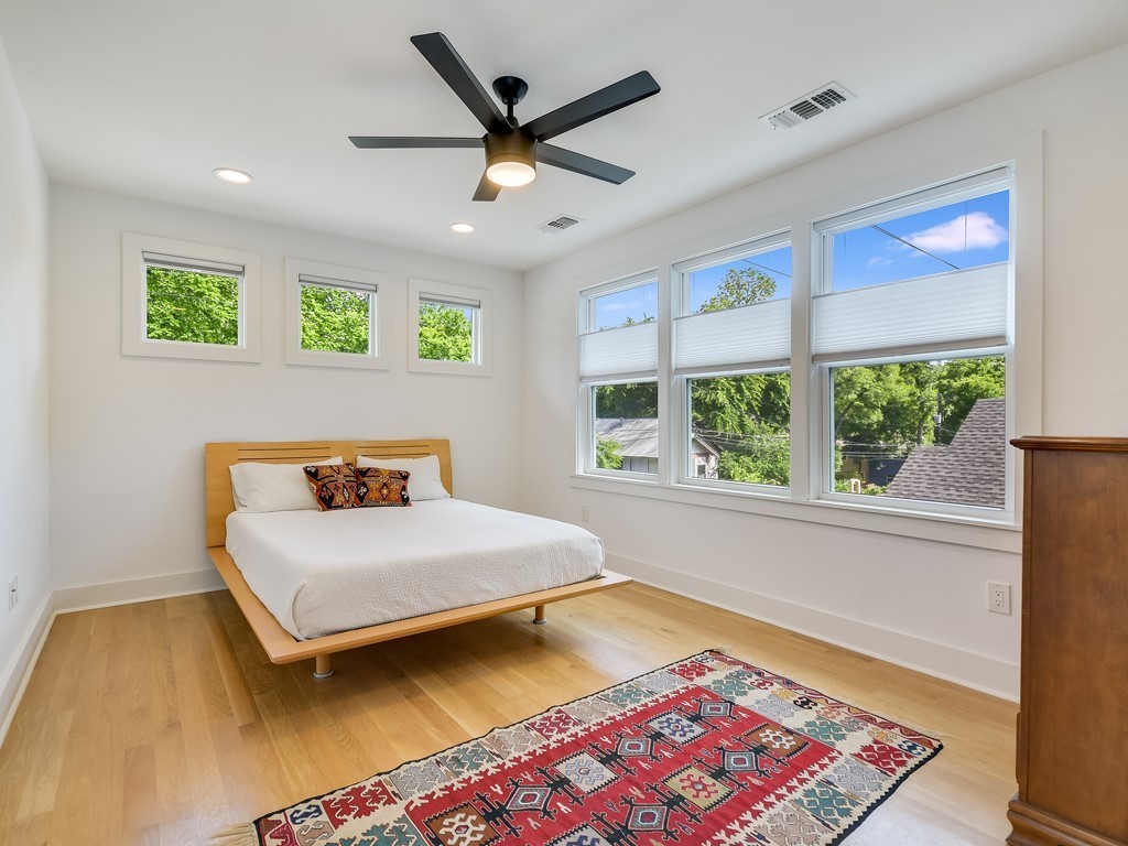 1313 Garden Street Austin, TX 78702 - Photo 16 of 23 a bedroom with a bed and a large window